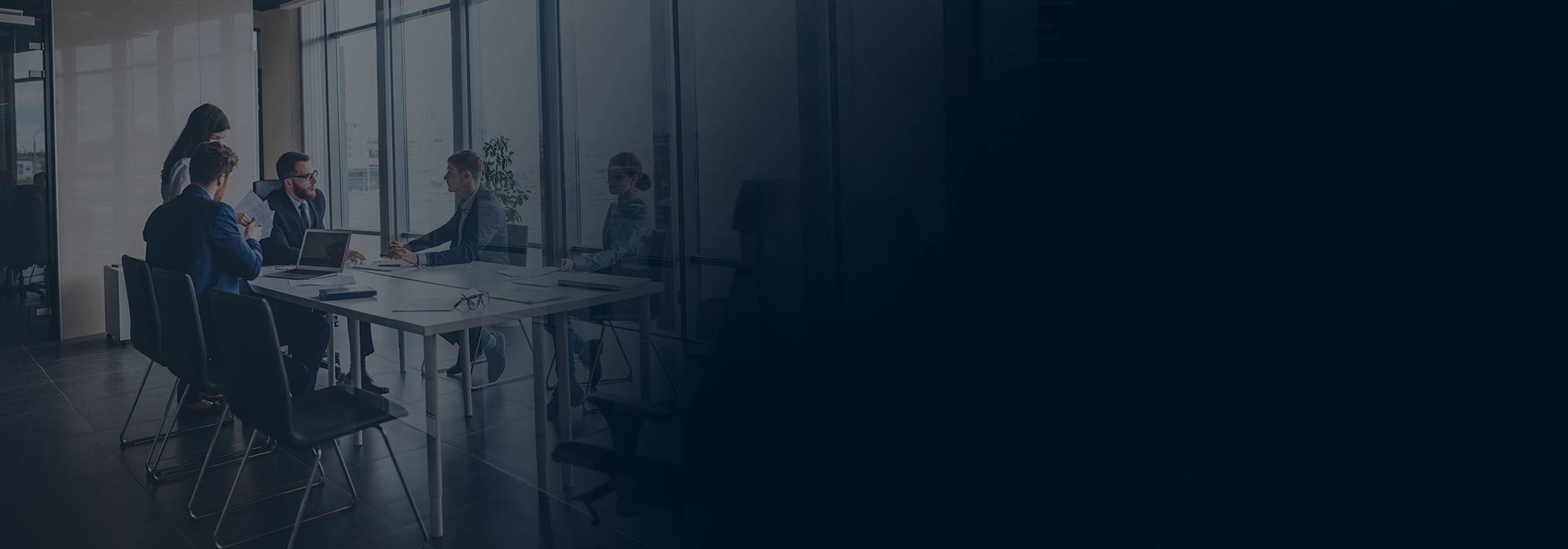 A team meeting around a table in a bright office